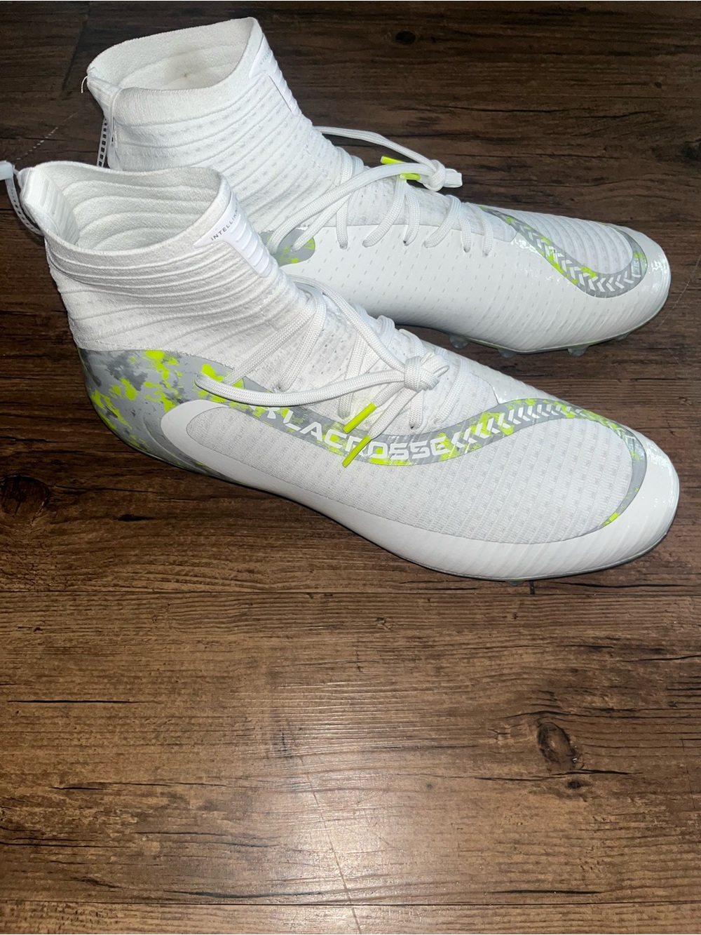 Under Armour White Athletic Cleats with Neon Yellow Accents